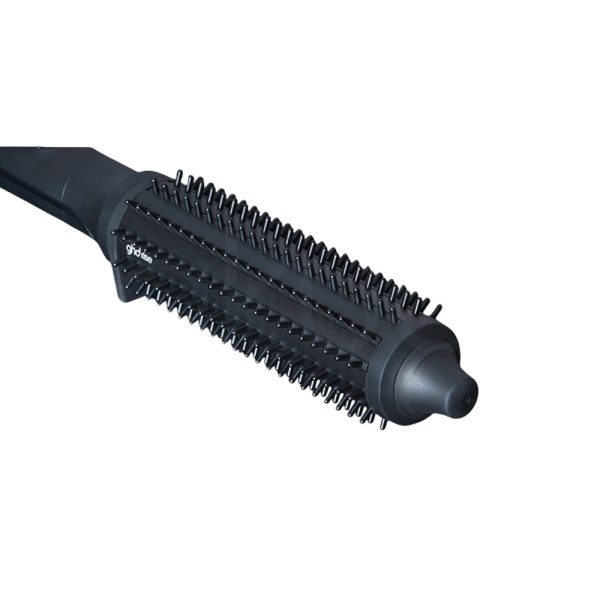 Cepillo electrico ghd Rise el color predominante en la imagen es negro mate, tanto en el cepillo eléctrico ghd rise. La caja presenta detalles en el logotipo y elementos gráficos, mientras que el cepillo tiene un pequeño anillo metálico en tono plateado cerca de la base del mango H2o Akua