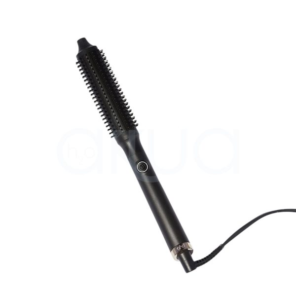 Cepillo electrico ghd Rise el color predominante en la imagen es negro mate, tanto en el cepillo eléctrico ghd rise. La caja presenta detalles en el logotipo y elementos gráficos, mientras que el cepillo tiene un pequeño anillo metálico en tono plateado cerca de la base del mango H2o Akua
