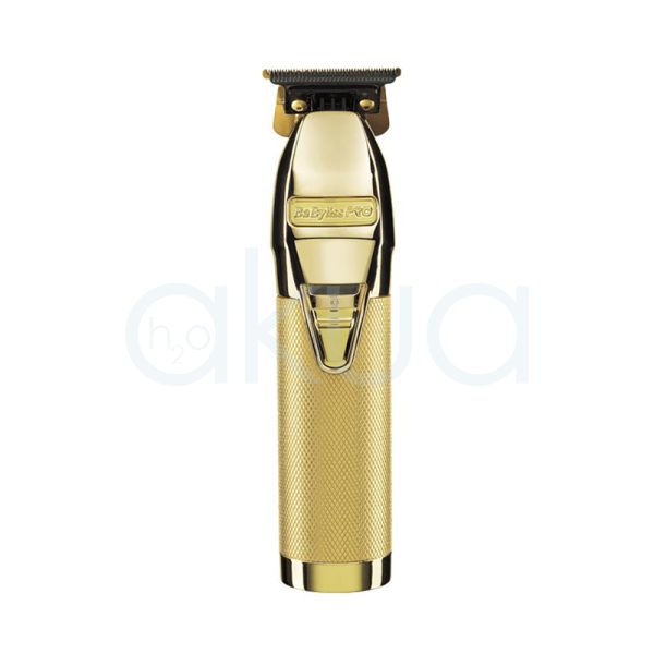 Maquina Skeleton Gold Ferrari babyliss pro El color predominante es dorado metálico. Todo el cuerpo del dispositivo, incluyendo el mango texturizado, la carcasa y los detalles frontales, presenta un acabado brillante en dorado. La cuchilla y algunos elementos superiores son de color negro H2o Akua