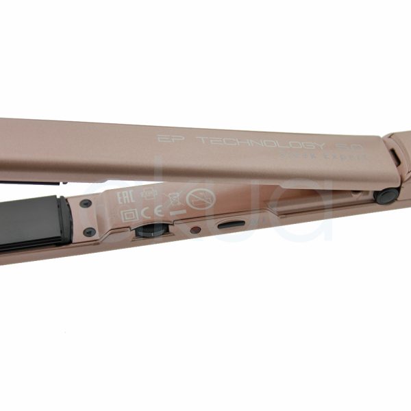 Plancha Sleek Expert Babyliss Pro BAB2072EPE El color predominante es rosa dorado mate (rose gold), que cubre todo el cuerpo y el mango de la plancha. Las placas alisadoras son de color negro brillante. El logotipo "BaByliss PRO" aparece en blanco y rojo sobre el fondo rosa dorado H2o Akua