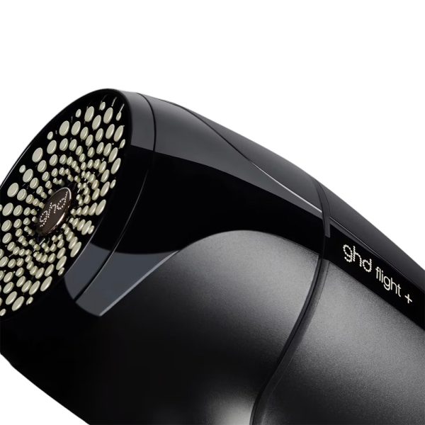 Secador ghd de viaje Flight+ cuerpo donde predomina el color negro con detalles en los controles de aire y porta filtros en dorado H2o Akua