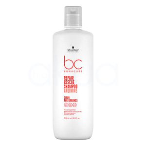 Champu Bonacure Repair rescue 1000ml El envase del producto es blanco mate, tanto en el cuerpo de la botella como en la tapa. Los textos principales, incluyendo el logotipo “bc Bonacure” y la información clave del producto, están impresos en un rojo intenso que resalta sobre el fondo blanco. El logotipo de la marca Schwarzkopf Professional, ubicado en la parte superior, es de color negro. H2o Akua
