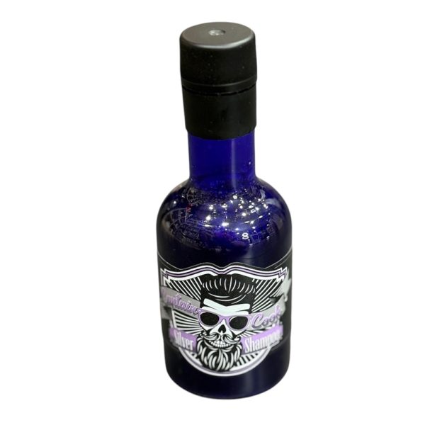 Champu canas Captain Cook 250ml El frasco es de color azul oscuro o azul cobalto, con un tapón negro. La etiqueta combina tonos blanco, negro y detalles en lila o morado claro H2o Akua