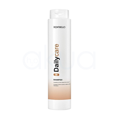 Champu cabello sensible Daily Care Montibello 300ml. Envase cilíndrico blanco y el diseño presenta el nombre “Daily Care” en negro y dorado en vertical, con una banda dorada en la parte inferior. H2o Akua
