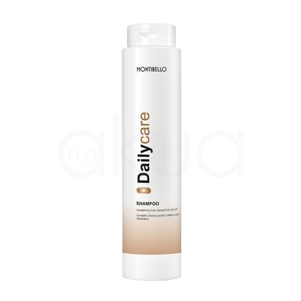 Champu cabello sensible Daily Care Montibello 300ml. Envase cilíndrico blanco y el diseño presenta el nombre “Daily Care” en negro y dorado en vertical, con una banda dorada en la parte inferior. H2o Akua