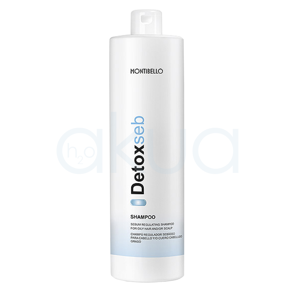 Champu regulador Detox Seb Montibello 1000ml Envase cilíndrico, alargado y vertical, con tapa tipo flip top en la parte superior. El color predominante es blanco, con detalles de texto en negro y azul claro, además de una franja azul en la parte baja del envase. H2o Akua
