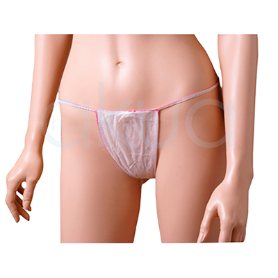 Tanga desechable papel mujer 100unid. Tiene un color blanco translúcido y está confeccionado en material no tejido, ligero y fino. La forma es triangular en la parte frontal, con tiras elásticas finas de color rosa que se ajustan a la cintura, ofreciendo cobertura esencial para zonas íntimas durante tratamientos de estética o depilación. H2o Akua