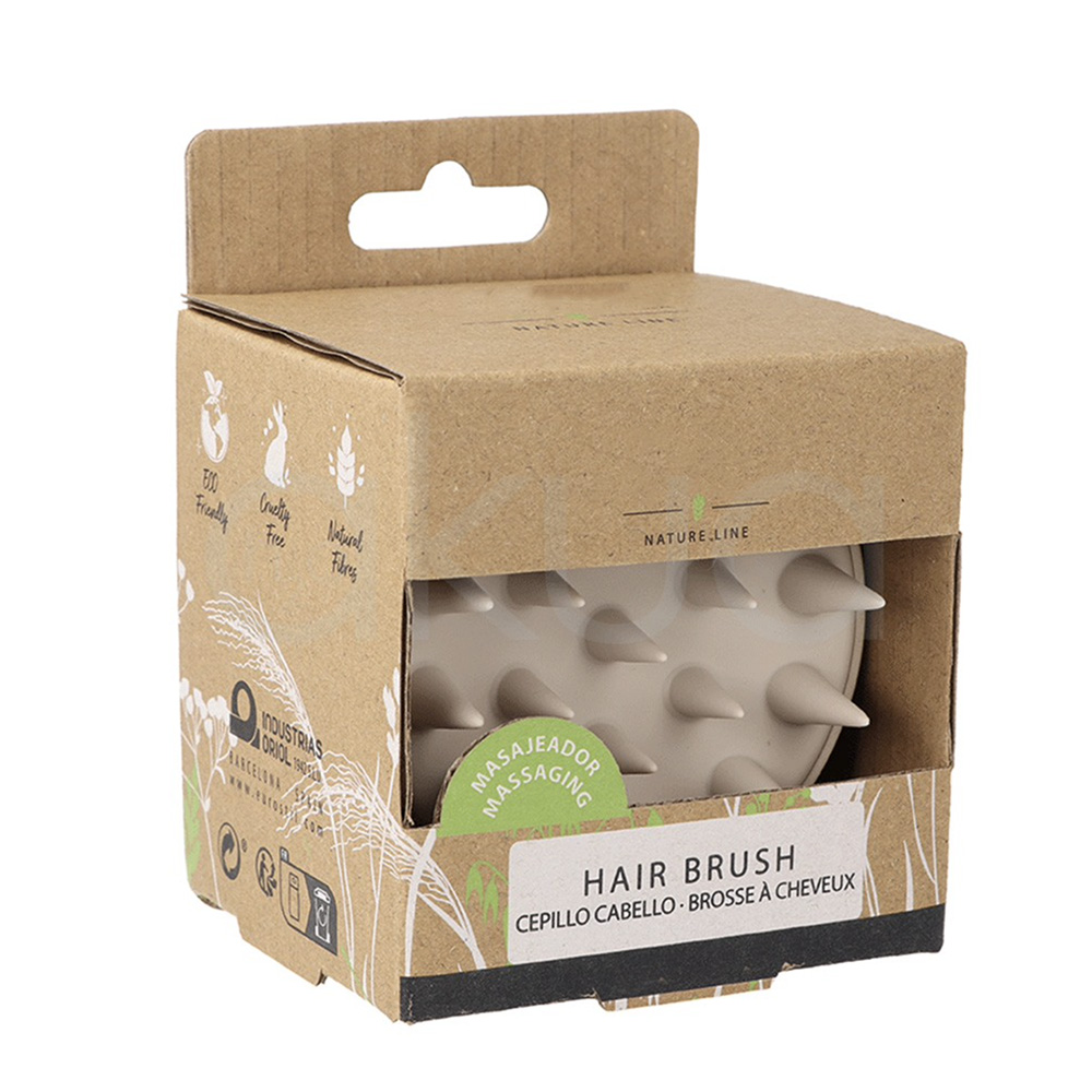 Cepillo masajeador cabello nature oval eco. Masajeador capilar manual de color beige claro. Su forma es circular y compacta, con una base plana de la que salen múltiples púas largas y suaves de silicona, diseñadas para masajear el cuero cabelludo. H2o Akua