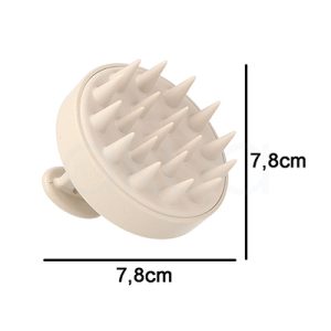 Cepillo masajeador cabello nature oval eco. Masajeador capilar manual de color beige claro. Su forma es circular y compacta, con una base plana de la que salen múltiples púas largas y suaves de silicona, diseñadas para masajear el cuero cabelludo. H2o Akua