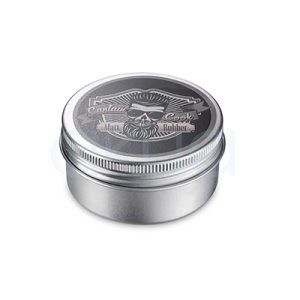 Pomada Rubber Matt Captain Cook 50ml Envase metálico de tapa roscada, acabado en plata, que corresponde a la pomada Captain Cook Matt Rubber. En la tapa se aprecia un diseño gráfico con la imagen de un hombre barbudo, gafas y peinado moderno. H2o Akua