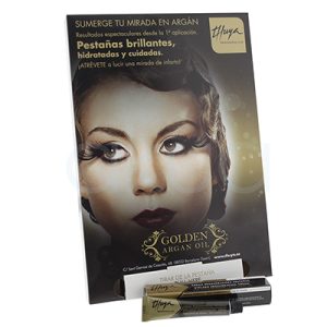 Expositor Crema regeneradora pestañas Thuya 11ml. La imagen muestra un expositor publicitario de la línea Thuya Professional con el mensaje "SUMERGE TU MIRADA EN ARGÁN". El expositor destaca una crema regeneradora de pestañas enriquecida con aceite de argán, presentando una fotografía de un rostro femenino con pestañas largas, brillantes y voluminosas. En la parte inferior se exhibe el producto, preparado tanto para prueba o compra en punto de venta. H2o Akua