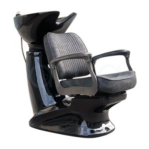 Lavacabezas barbero Stafford negro 06957/50. La imagen muestra un lavacabezas profesional de estilo vintage, acabado en negro brillante, con asiento y respaldo tapizados en polipiel negra de líneas verticales, y reposabrazos curvados ergonómicos.