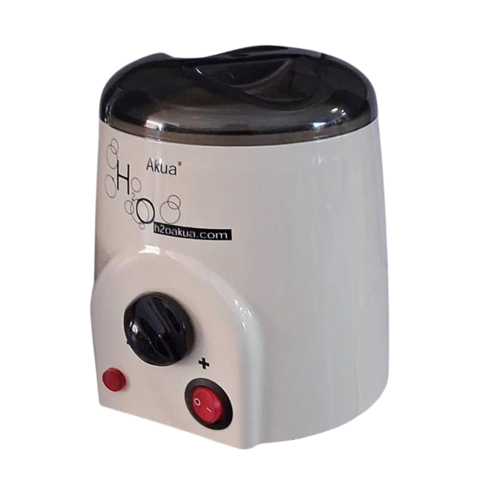 Fundidor cera 250ml H2oakua. La imagen muestra un pequeño calentador de cera de sobremesa de la marca Akua, de forma cilíndrica y color blanco crema, con tapa superior oscura semitransparente. En la parte frontal lleva un panel sobresaliente con un mando giratorio negro para regular la temperatura, un interruptor rojo de encendido/apagado y un piloto luminoso redondo más pequeño. H2o Akua