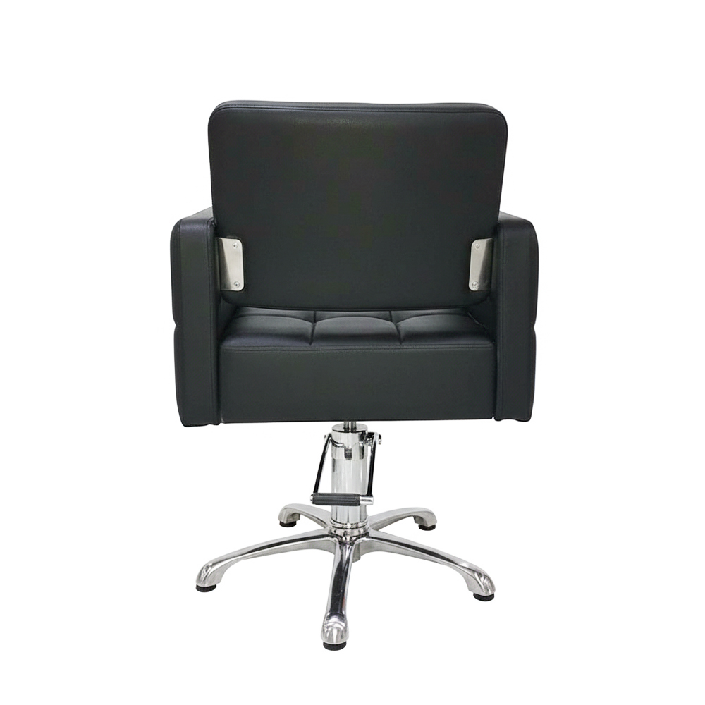 Sillon Glamour 07190. Sillón de peluquería negro con diseño cúbico moderno y capitoné acolchado en cuadrícula con botones.