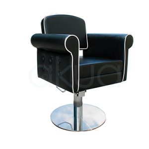 Sillon pie redondo Style negra 06095/50/2. Modelo de peluquería o barbería en estilo vintage o retro capitoné, con tapizado negro en polipiel y ribetes blancos contrastantes. H2o Akua