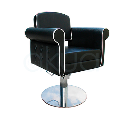 Sillon pie redondo Style negra 06095/50/2. Modelo de peluquería o barbería en estilo vintage o retro capitoné, con tapizado negro en polipiel y ribetes blancos contrastantes. H2o Akua