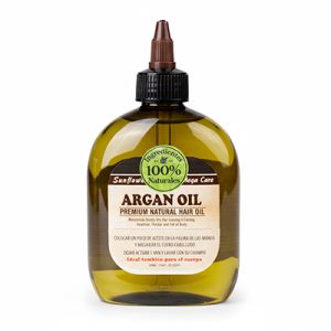 Aceite hidratante Oliva premium cabello y cuerpo 230ml Outlet. Es un bote ámbar translúcido de 230 ml con gotero marrón, etiqueta verde/amarilla destacando "Argan Oil Premium Natural Hair Oil", advertencias contra daños por decoloración/permanente y uso en manos/pies. H2o Akua
