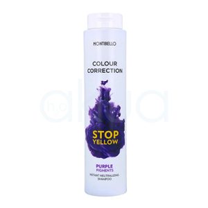 Champu Neutralizante Stop Yellow Montibello 300ml. Envase cilindrico blanco. En la parte frontal destaca una mancha de pigmento violeta con el texto “STOP YELLOW” en amarillo y, debajo, “PURPLE PIGMENTS Instant Neutralizing Shampoo”, indicando que es un champú con pigmentos violetas para corregir reflejos amarillos en cabellos rubios o decolorados. H2o Akua