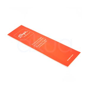 Protector papel para tinte Thuya. La imagen muestra un empaque alargado y delgado de color naranja/rojo vibrante de la marca Thuya, con el logo "Thuya" en negro elegante en la parte superior y texto en español: "Protector Papel para Tinte". H2o Akua