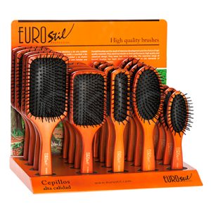 Expositor 20 cepillos madera planos Eurostil. Expositor de sobremesa Eurostil Professional con varios cepillos planos de madera en diferentes tamaños. Los cepillos cuentan con base acolchada negra y púas flexibles con puntas redondeadas para un peinado suave y cómodo. El expositor, en tonos marrón y naranja, incluye el logotipo de Eurostil y el texto “Cepillos alta calidad”, pensado para presentación y venta profesional en peluquerías y tiendas de belleza. H2o Akua