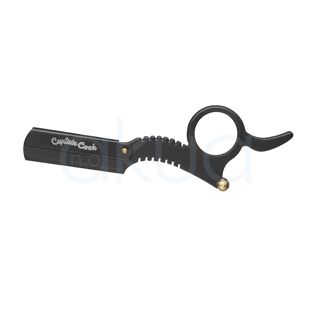 Navaja retoques Captain Cook. Navaja profesional de retoques Captain Cook en color negro mate, diseñada para perfilados y acabados de precisión. Presenta un mango ergonómico con anilla para mejor control y soporte para el dedo, además de un sistema dentado decorativo en la parte central. Su diseño compacto y ligero facilita el manejo en trabajos de barbería y peluquería profesional. Ideal para definir contornos, patillas, barba y detalles de corte con máxima precisión. H2o Akua