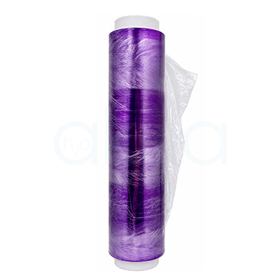 Plastico film osmotico desechable 300m H2oAkua. Rollo de film osmótico transparente de color morado sobre fondo blanco, parcialmente desenrollado, utilizado en tratamientos estéticos corporales y envolturas profesionales.