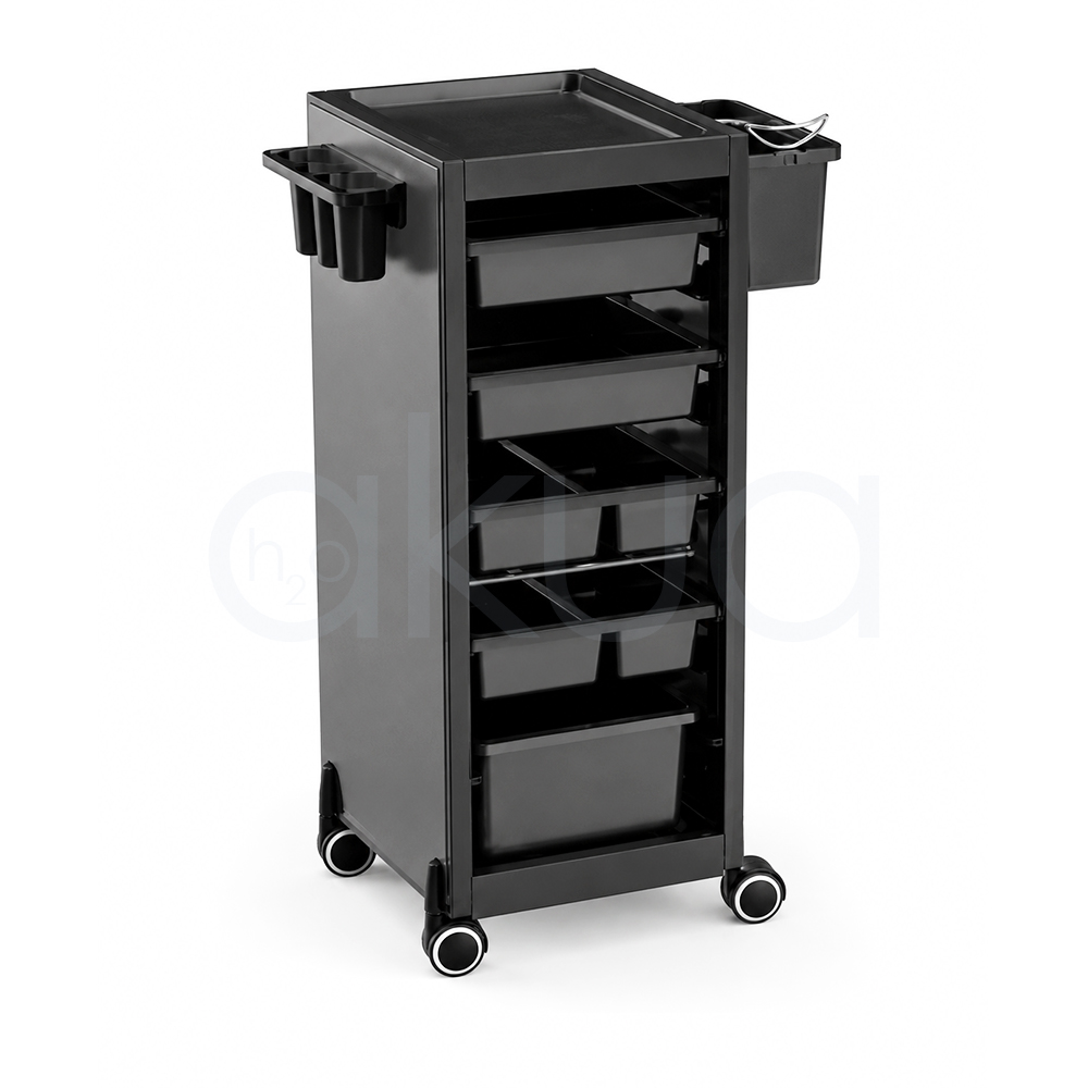Carrito Rodium H2oAkua. Carro auxiliar profesional de peluquería en color negro con diseño compacto y moderno. Dispone de una bandeja superior para herramientas y productos, varios cajones organizadores de diferentes tamaños en la parte frontal y compartimentos laterales para accesorios de uso frecuente. Incorpora cuatro ruedas giratorias que facilitan su desplazamiento por el salón. Su estructura vertical permite aprovechar el espacio manteniendo ordenados utensilios, productos y herramientas de trabajo