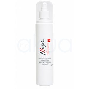 Solucion higienico preparadora Thuya 250ml. Botella pulverizadora blanca de 125 ml de la línea profesional Thuya. El envase es cilíndrico y cuenta con un difusor blanco protegido por una tapa transparente. En la etiqueta frontal aparece el logotipo de Thuya en gris y rojo, junto al texto "Solución Higiénico Preparadora / Preparatory Hygienic Solution". El diseño es minimalista y está fotografiado sobre un fondo blanco, resaltando el aspecto limpio y profesional del producto. H2o Akua