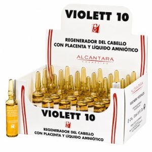 Ampollas Regeneradoras para el Cabello Violett 10 Alcántara – 24 Unidades. Caja expositora abierta de Violett 10 de Alcántara Cosmética sobre fondo blanco, con 24 ampollas de cristal color ámbar colocadas en varias filas en su interior. El envase es blanco, con líneas rojas y el nombre “VIOLETT 10” en grandes letras negras. En la parte frontal y trasera se lee “Regenerador del cabello con placenta y líquido amniótico” y aparece el logotipo de Alcántara Cosmética. A la izquierda de la caja se muestra una ampolla individual para apreciar mejor el formato del producto.